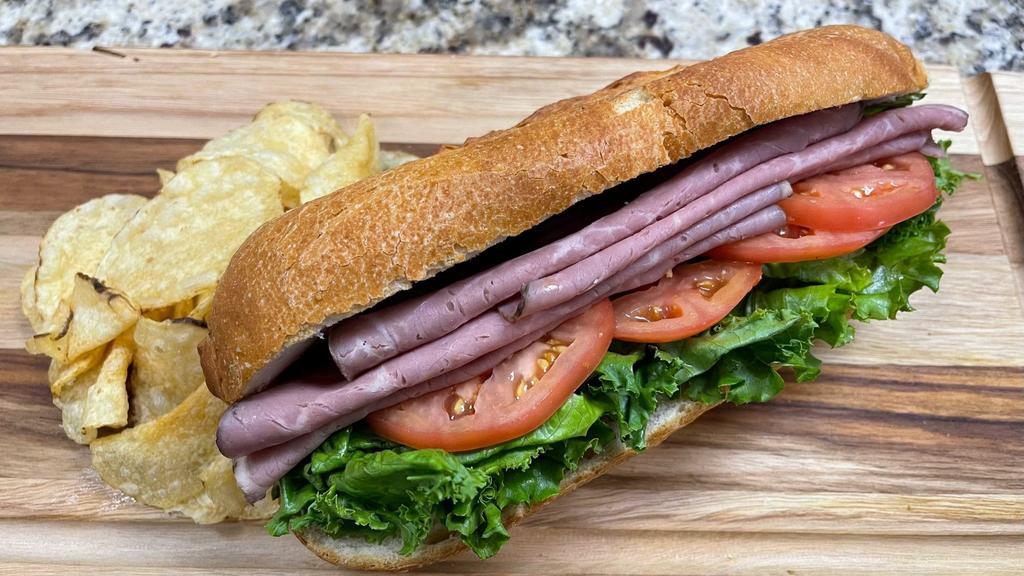 Roast Beef And Herb Cheese · Juicy roast beef served with a delicate herb cheese spread, lettuce, and tomato.