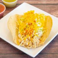 Chicken Taco A La Plancha · Served crispy with shredded chicken, lettuce, cheese and taco sauce