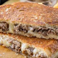 Steak Melt  (Favorite) · Shaved steak with cheese sandwiched between country bread (like a grilled cheese but better!).