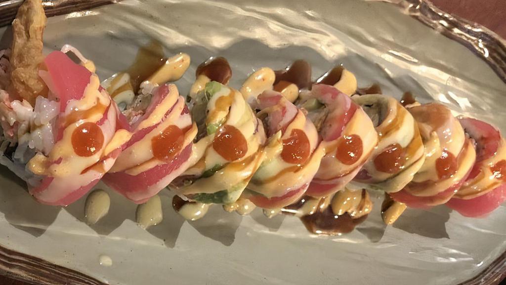 Samurai Roll · Shrimp tempura, crabmeat, cucumber with tuna and avocado on top with four kinds of sauce.