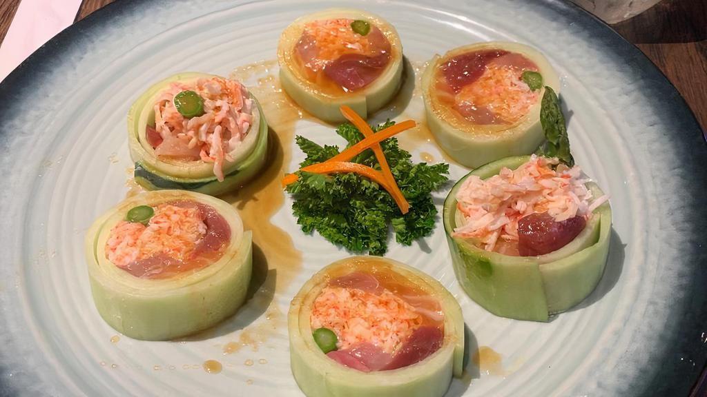 Lily Roll (Riceless Roll) · Tuna, salmon, yellowtail, crabmeat, asparagus, wrapped salmon with cucumber. Apple sauce and sweet sauce.