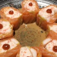 Rose Roll (Riceless Roll) · Cooked shrimp, crabmeat wrapped with soy paper and spicy sauce on top. Served with a special...