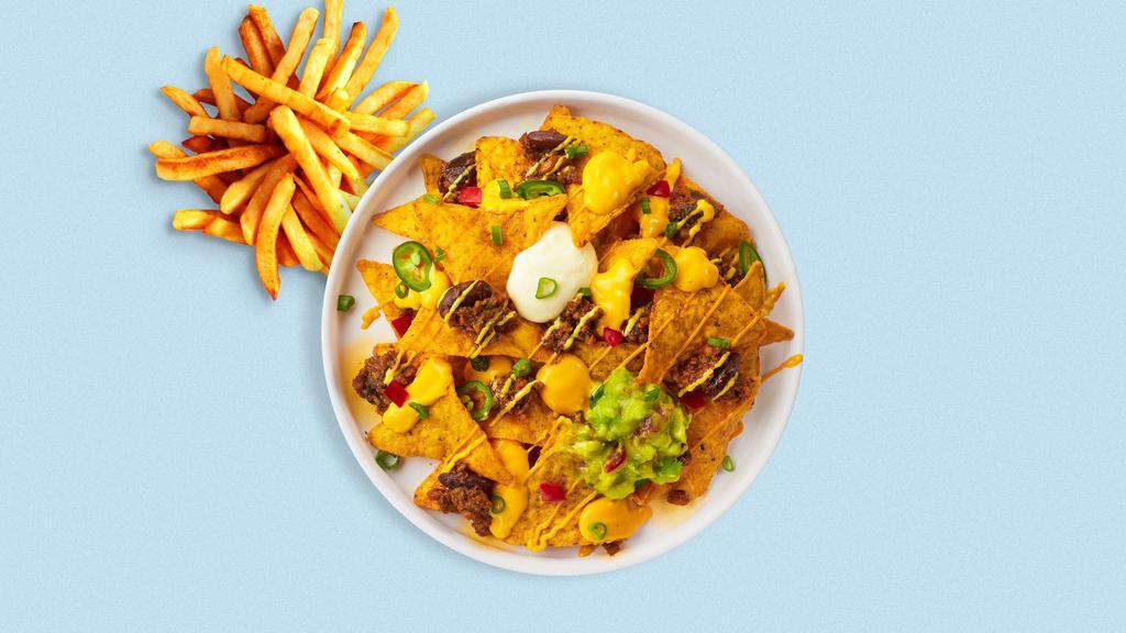 Loaded Nachos · Tortilla chips doused in chili, cheese, seasoned ground beef, black olives, tomato, onion, salsa, and sour cream.