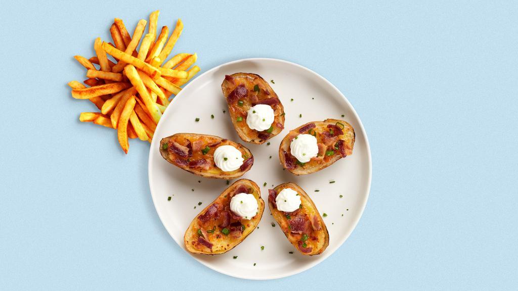 Potato Skins · Baked potato skins filled with bacon, cheddar cheese and sour cream.