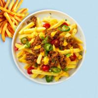 Loaded Fries · Idaho potato fries cooked until golden brown and garnished with ground beef, chili, Cheddar ...