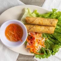 Crispy Egg Rolls (2 Pieces) · Classic Starter,  wheat wrapper crispy egg rolls are filled with vegetables, deep fried, ser...
