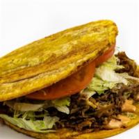 Patacon · Double fried plantains on top & bottom with your choice of grilled meat, served with lettuce...