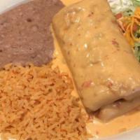 Super Chimichanga · A deep fried extra large flour tortilla, filled with shredded beef or shredded chicken, saut...