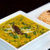 Dal Amritsari · Yellow lentils tempered with onion, tomatoes and whole red chilli.