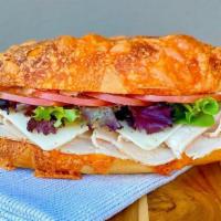 Chipotle Turkey · Sliced roasted turkey, pepper jack cheese, sliced tomato, spring mix and chipotle spread. Se...