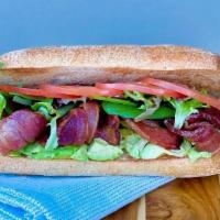 L.T.A. + Beverage & Chips · Applewood smoked bacon, ripe avocado, sliced tomato, spring mix and aioli spread. Served on ...