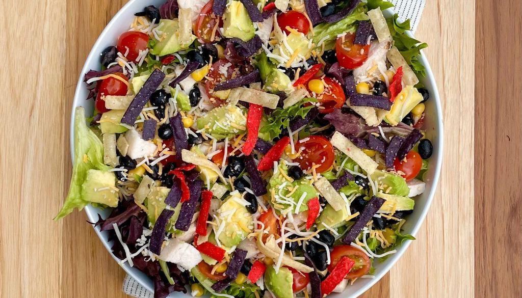 Fiesta · Chicken breast, ripe avocado, cherry tomato, black beans, corn, cheddar Jack cheese, tortilla strips and spring mix Served with jalapeno ranch dressing.