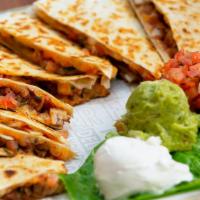 Chicken Quesadillas  With Fries · Seasoned Grilled Chicken, Shredded Monterey Jack and Cheddar Cheese,  and Pico de Gallo in a...