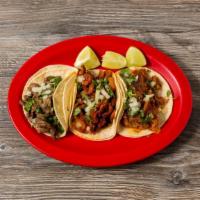 Tacos · All tacos are topped with chopped onions and cilantro. Your choice of corn or flour tortilla...