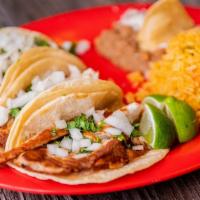 Fish Tacos · Three tilapia tacos topped with onions and cilantro. Serve with rice and beans. Your choice ...