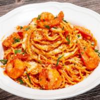 Spaghetti With Shrimp · Fresh tomato, basil, chili oil, Parmesan cheese, pepe, and butter monte.