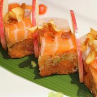 Triple Hako Roll (10 Pieces) · Inside: spicy crunch tuna mixed with cilantro, jalapeño. Outside: yellowtail, salmon, crispy...