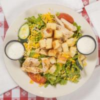 Grilled Chicken Salad · Strips of flavorful mesquite grilled chicken, served on crispy salad greens with Swiss and c...