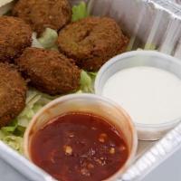 Falafel · Six pieces. White sauce and spicy sauce.