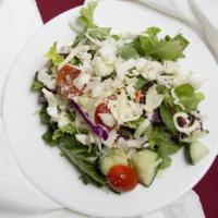 House Salad · Mixed greens, tomatoes, cucumbers mozzarella cheese.