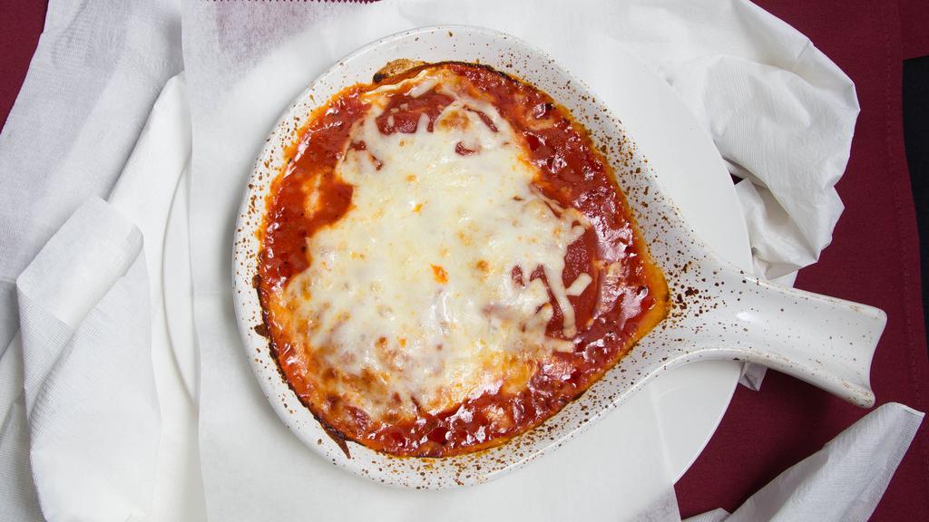 Cheese Ravioli · Baked in an oven with marinara and mozzarella cheese.