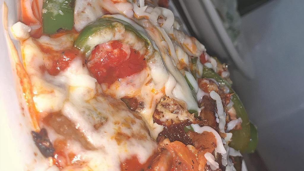Sausage Pepper Parmigiana · Sliced Italian sausage, sliced bell peppers placed on top of spaghetti pasta and smothered in marinara sauce and mozzarella cheese then baked in the oven.