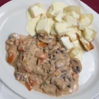 Chicken Roma · Breaded chicken breast covered in a creamy marsala wine sauce with fresh mushrooms and a sid...