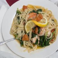 Shrimp Scampi · Linguine pasta sauteed in a lemon butter sauce with green onions, tomatoes fresh spinach.