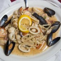 Linguine Tutto Mare · Sauteed shrimp scallops, clams, calamari, mussels, fresh rivons, tomatoes in a red or white ...