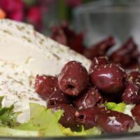 Feta Cheese And Olives · Feta cheese and kalamata olives sprinkled with olive oil.