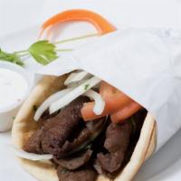 Gyros · Thinly sliced Greek seasoned beef and lamb cooked on a vertical rotisserie wrapped in pita b...