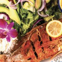 Red Snapper (New) · A Whole Red Snapper, Fried & Served With Apple Mango Salad, Garlic Sauce & White Rice On The...