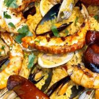 Paella Lucia'S · Yellow rice, seafood stock, lobster, calamari, mussels, clams, shrimp and Mexican chorizo. C...