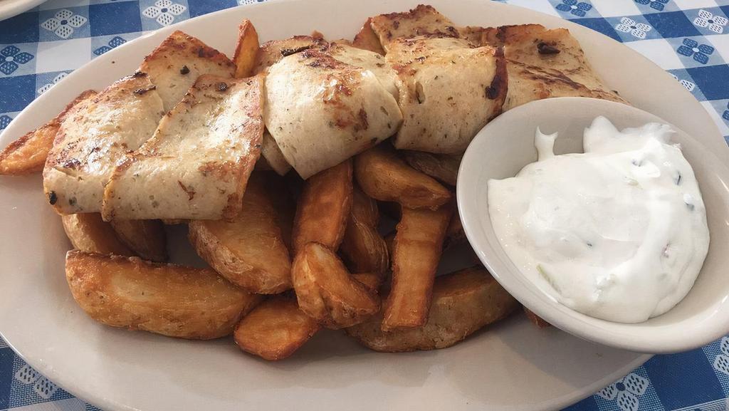 Grilled Chicken Breast Platter · Served with French fries or rice and a Greek salad.