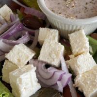 Greek Salad - Small · Small. Chopped lettuce with tomatoes, cucumbers, onions, peppers, stuffed grape leaves, feta...