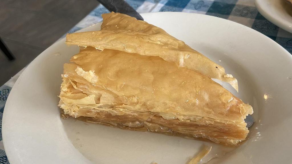 Baklava · Crushed walnuts and cinnamon in a phyllo dough with honey syrup.