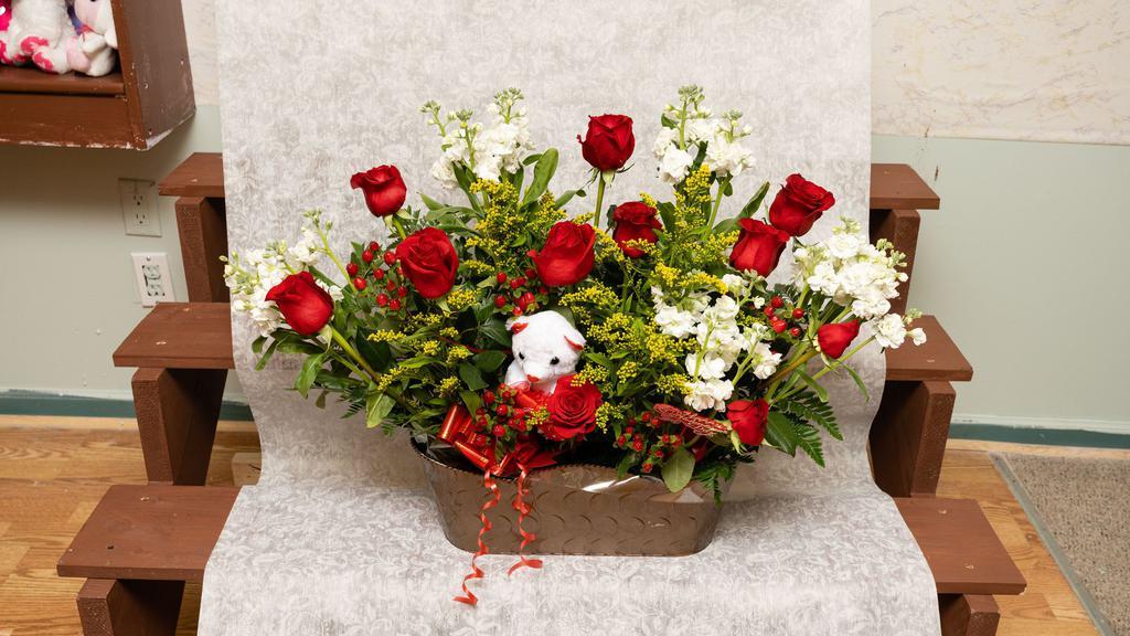 Bear Love · Show your love is the size as a bear, with this arrangment, 12 Roses, Solidago, Stocks, Carnations, and a small plush toy. (Basket Included)