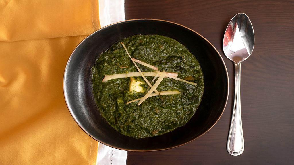 Saag Paneer · Fresh spinach cooked with cottage cheese, tempered with cumin, ginger and garlic.