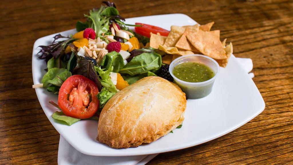 Platter 1 · One empanada served with a rustika house salad.