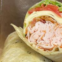 Turkey Ranchero Wrap · Cracked pepper turkey, pepperjack cheese, bacon, lettuce, tomato, and homemade ranch in a ga...