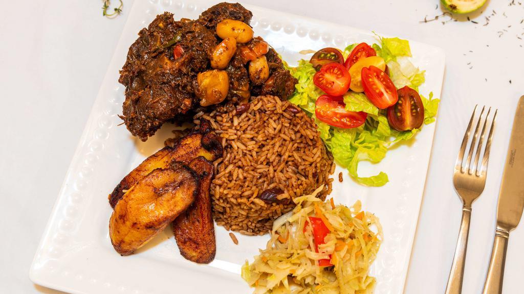 Oxtail Combo (Large) · Slow braised oxtail with carrots and butter beans. Served with steamed cabbage and rice and peas.