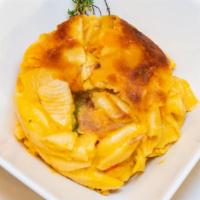 Mac & Cheese   · Macaroni pasta mixed with a blend of cheese slow baked to a gooey finish.