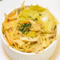 Steamed Cabbage · Steamed cabbage steamed and sautéed in our house spice blend.