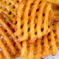 Waffle Fries · Crispy seasoned fries tossed in or classic fry seasoning or any WIO dry rub. Simply irresist...