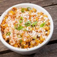 Small Street Corn · Grilled corn off-the-cob jacked up with red onion, jalapenos, scallions, chipotle ranch and ...