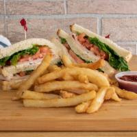 Turkey & Cheese Club Sandwich · Served with french fries.