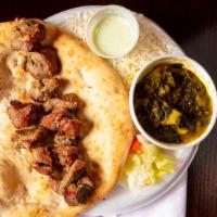 Lamb Kabob · Boneless marinated Lamb shoulder pieces cooked over hickory charcoal grill that includes a s...
