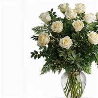 A Dozen White Long Stem Roses In A Vase · this bouquet features a dozen long stem white roses in a clear vase