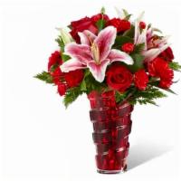 Lasting Romance Bouquet · This bouquet features red roses, pink lilies, red carnations and red mini carnation in a red...