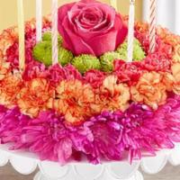 Birthday Flower Cake · birthday cake made with colorful real flowers  including candles